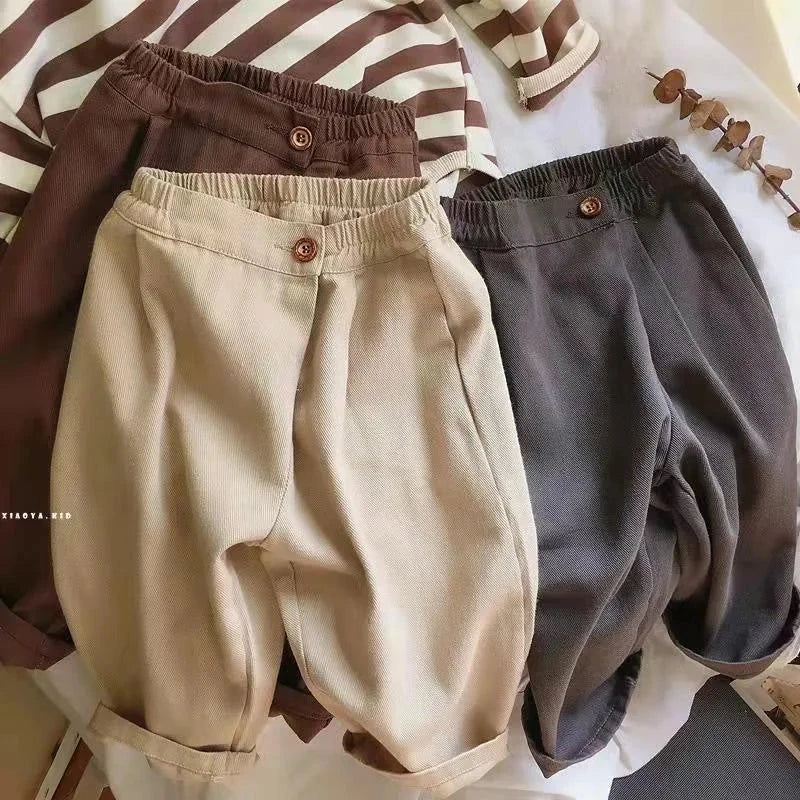 Unisex children wearing 2025 spring loose cotton harem trousers with elastic waist and pockets